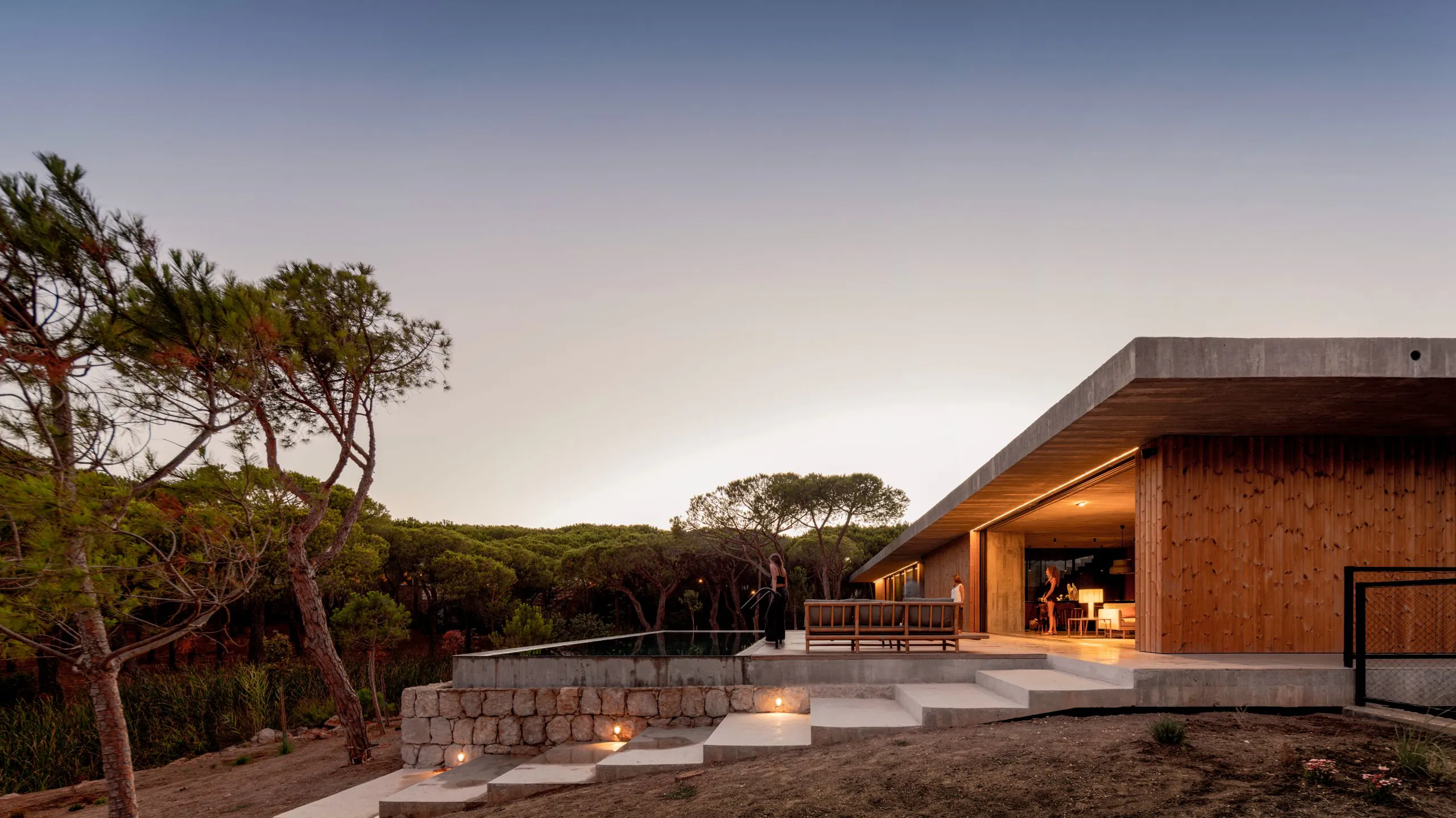 Coastal woodland house shaped for outdoor living