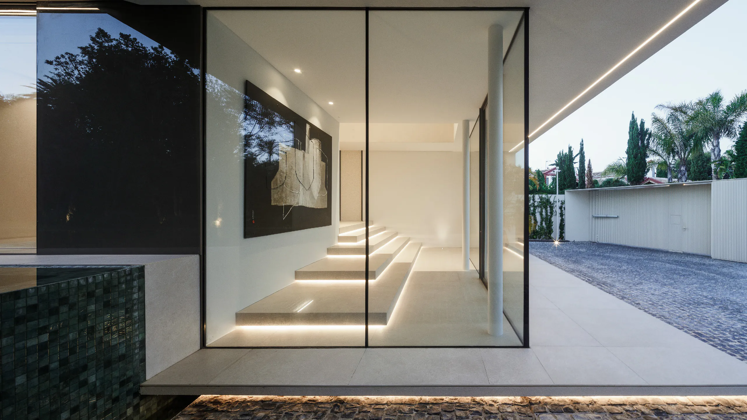 Exceptionally slender window profiles framing a bright architectural entrance