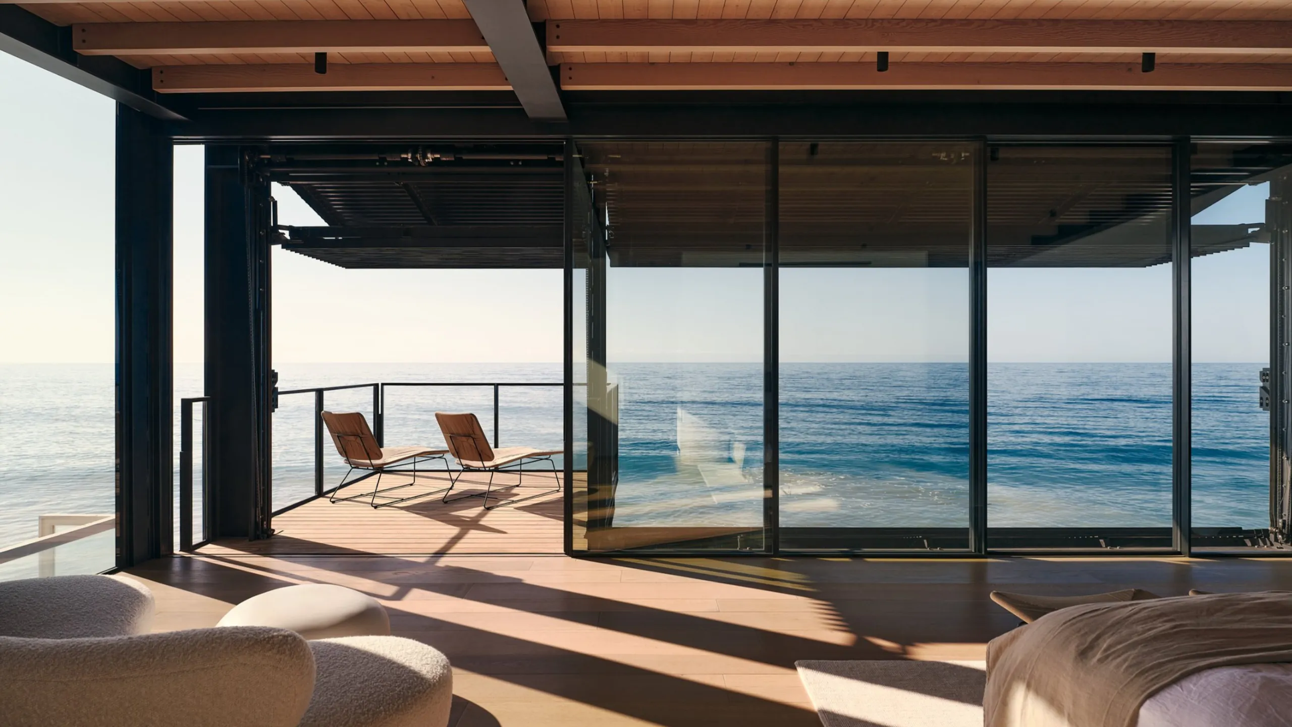 Wide coastal glass wall protected by a deep roof