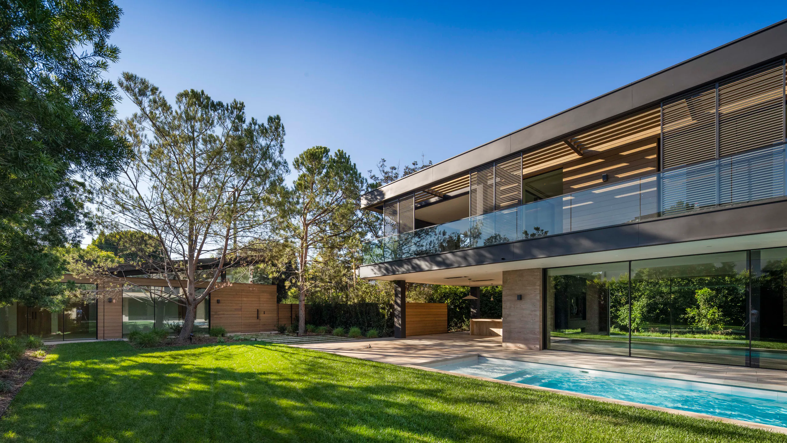 Garden residence with continuous shaded glazing