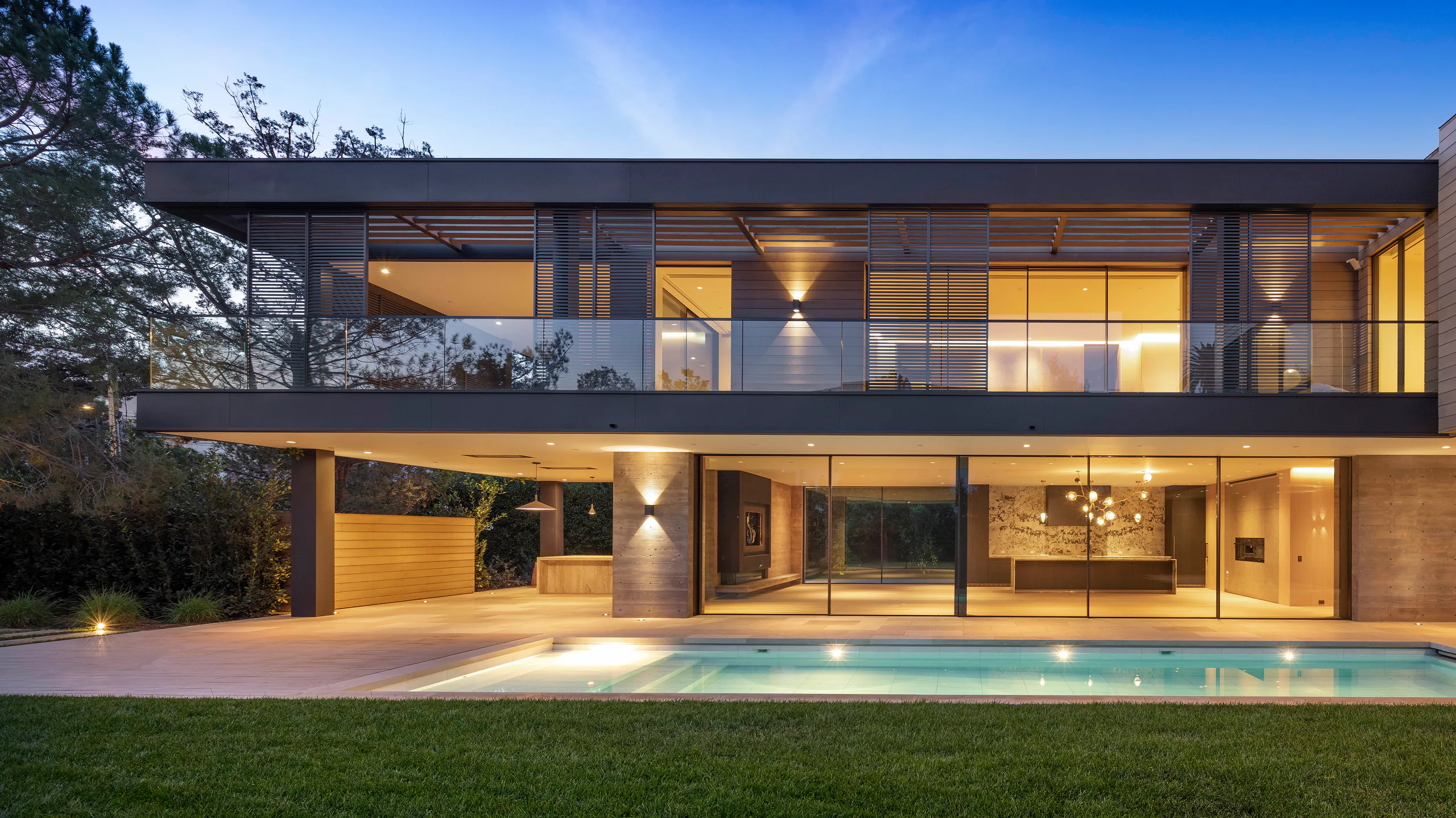 Established residence with a continuous illuminated glass facade