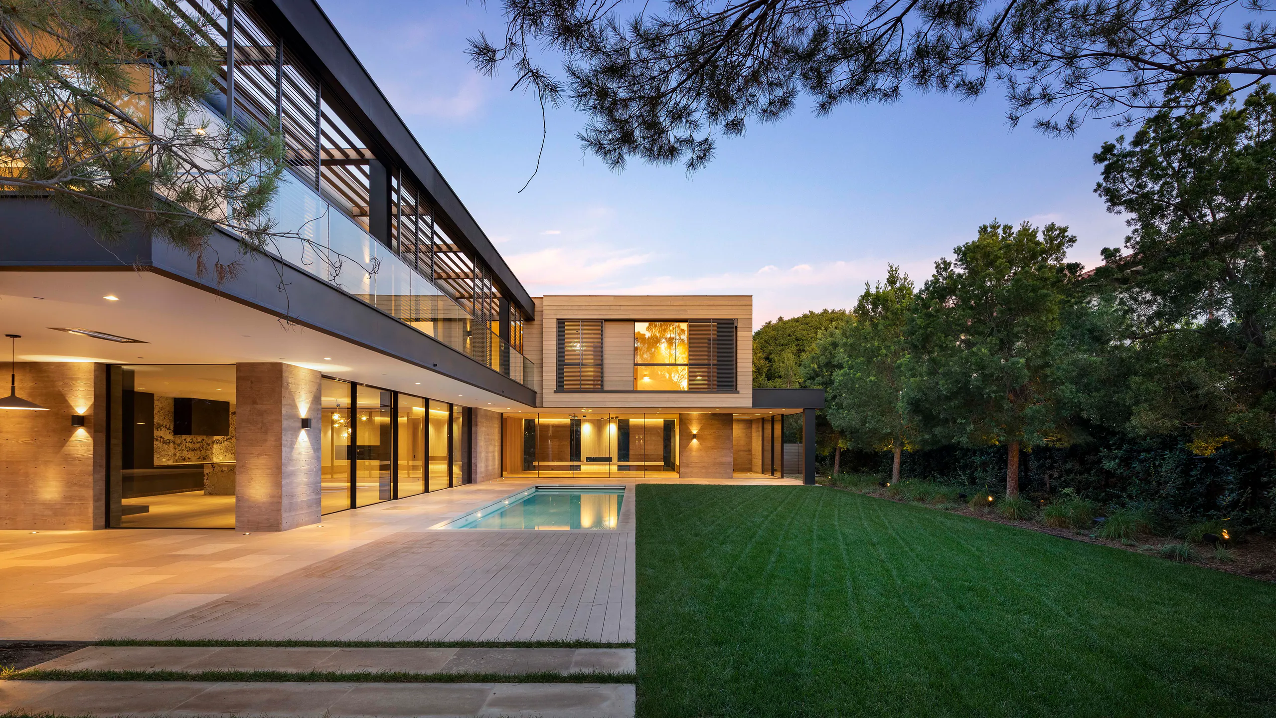 Garden residence with broad glazing and a sheltered pool