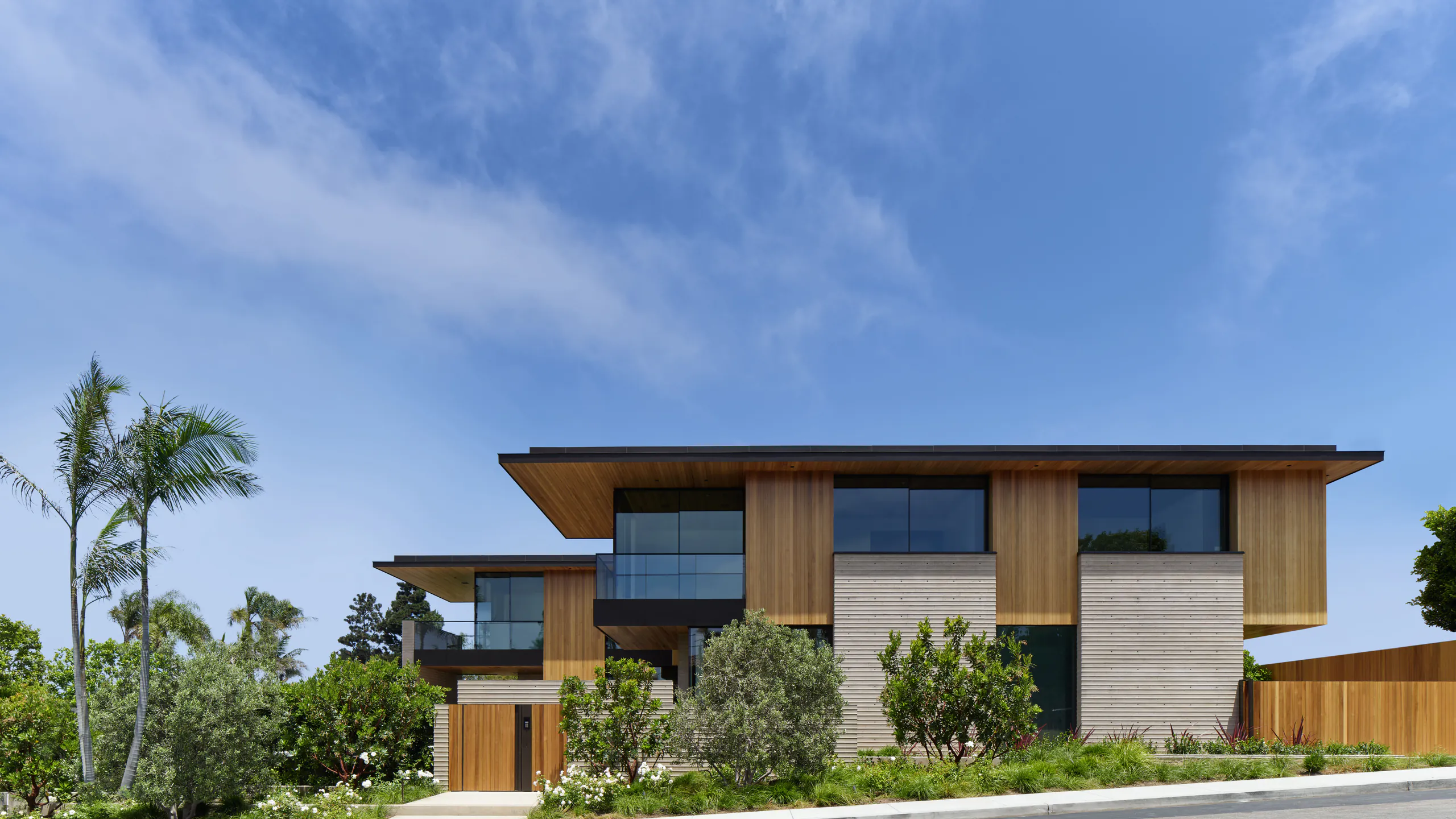 Tropical modern home beneath a clear blue sky