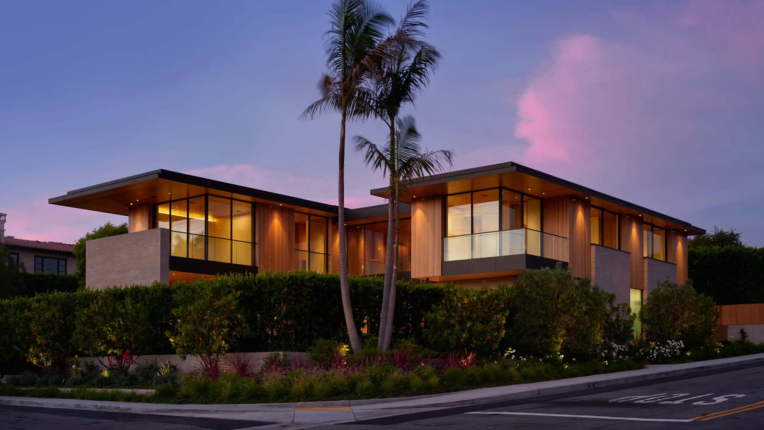 Palm-lined residence beneath a tropical evening sky
